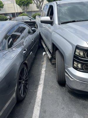 My car that got hit in their parking lot and the car that the prostitute got into (black Nissan)