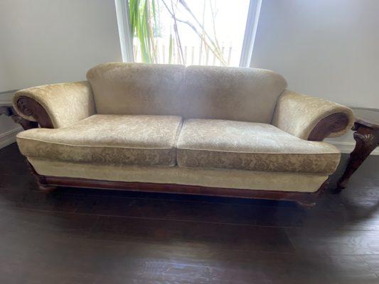 Couch that "needs to be vacuumed and cleaned"