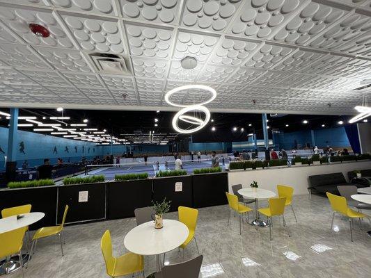 Dining area overlooking pickle ball courts