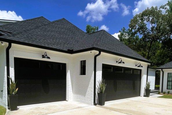 CHI OVERHEAD DOOR IN BLACK SHAKER DESIGN WITH WINDOWS INSTALLED BY THE  GARAGE DOOR INSTALLATION TEAM