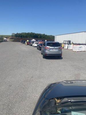 Line of cars for a Hazardous Waste Day dropoff.