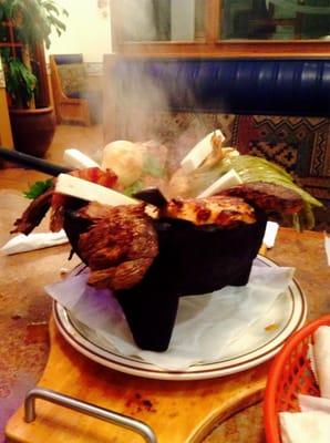 The Molcajete with chicken, steak, chorizo (the best!), nopales, queso fresco, shrimp, a jalapeño and green onion.