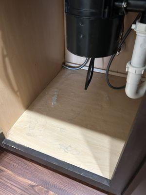 Water damage under the kitchen sink