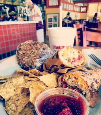 Turkey avocado wrap, chips and salsa, and an oatmeal cookie.