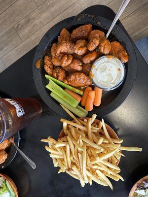 Medium hot wings with fries.