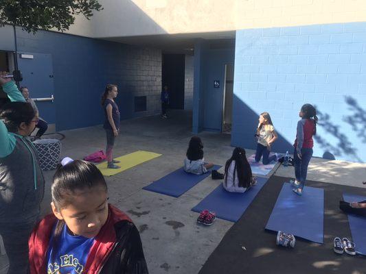 Angela teaching yoga strech‍