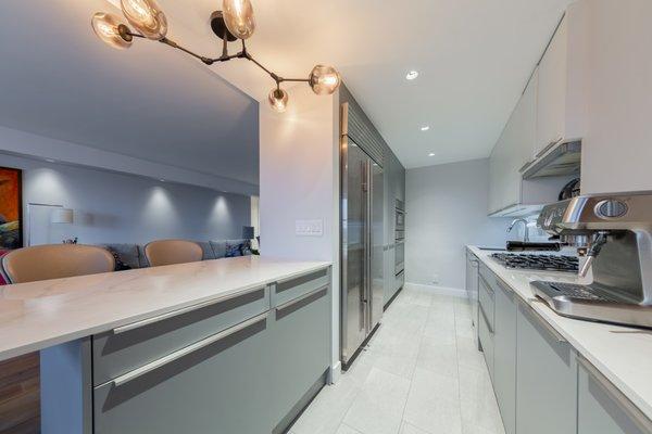 Kitchen Cabinets by LEICHT. Material: Topos walnut veneer wood, CERES laminated