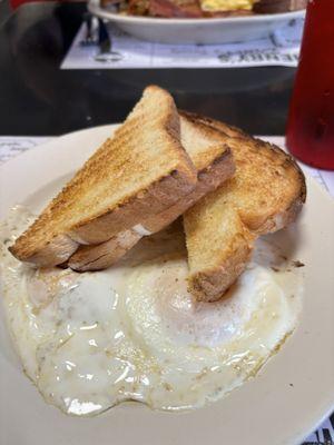 Eggs over medium with white toast