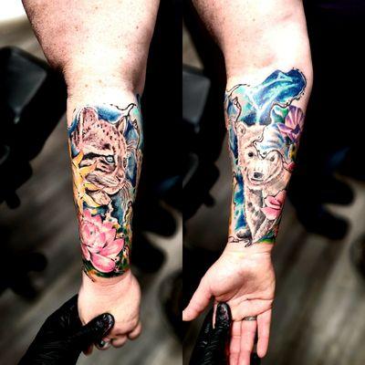 Clouded leopard and polar bear cub tattoo