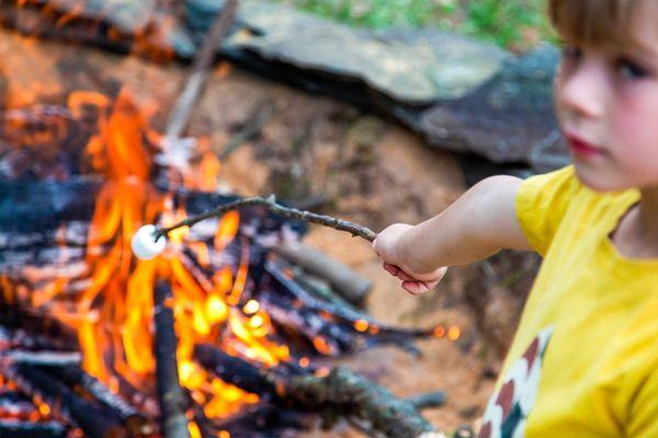 Hot Cocoa and S'mores package: Hot Chocolate, Marshmallows, Chocolate, Graham Crackers, and Roasting Sticks Included.