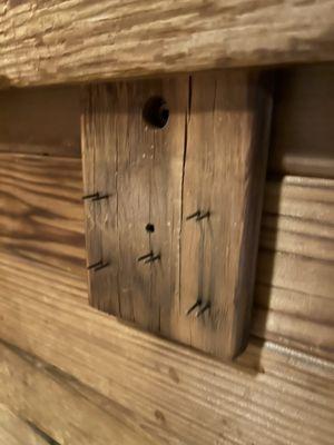 Exposed nails in sauna