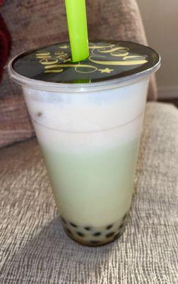 Honeydew milk tea with boba and sea salt foam.