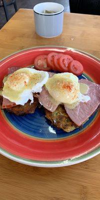 Zucchini cake Benedict with a side of tomatoes and local coffee