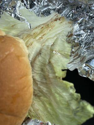 Rotten lettuce on my chicken sandwich.