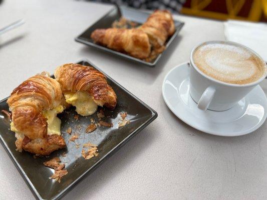 Breakfast sandwiches (left); latte (right).