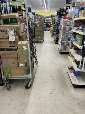 Floor is dirty, items on carts, etc that block free access down aisle and they block access to items on the shelf