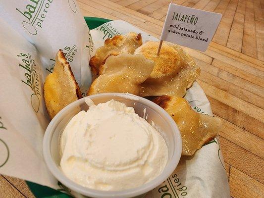 Pan-fried jalapeño pierogies with sour cream