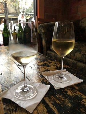 Left: wine tasting pour; right: full glass of wine