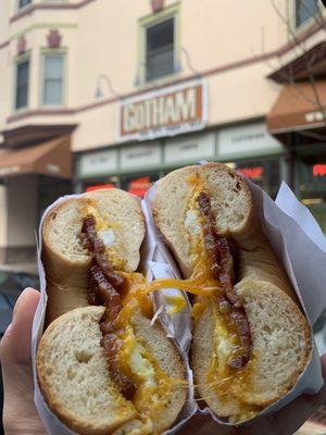 Bacon egg and cheddar on a plain bagel