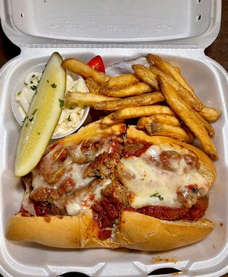 Meatball grinder with fries cole slaw and pickle