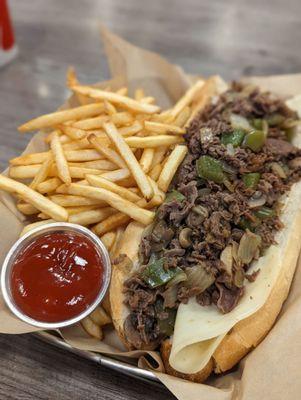 Large steak supreme with provolone and extra meat, and side of fries