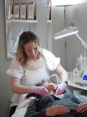 Crystal our amazing aesthetician providing Microdermabrasion