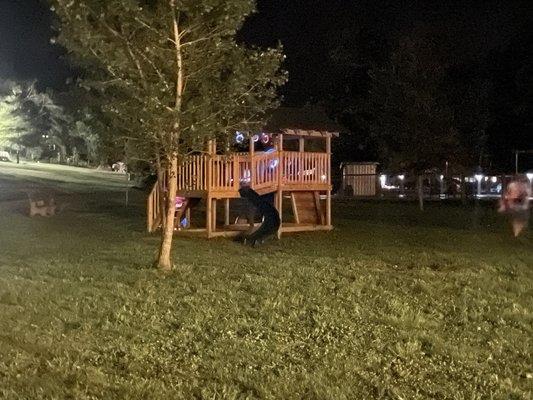 Playground lit up by kids with glow sticks