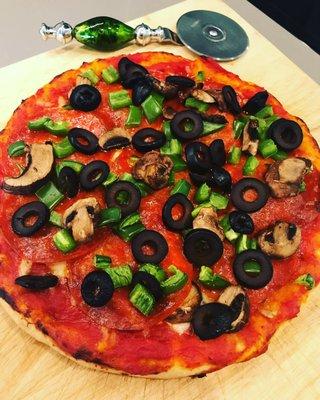 Vicolo crust, Whole Foods pizza sauce, uncured pepperoni, crimini mushrooms, black olive and jalapeños. Baked at 425 degrees for 15 minutes.