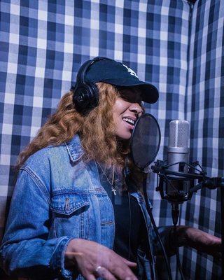 Singer Aysha Monet in the booth.