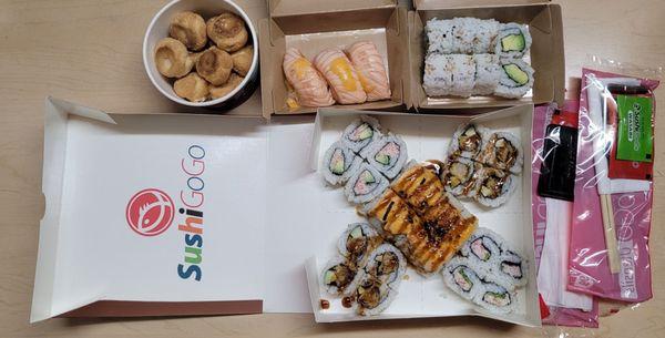 Top Left to Right: Cream Puff, Seared Salmon Nigiri and Avocado Roll Bottom: KK Combo (Shrimp Temura, Lion King and California Roll)