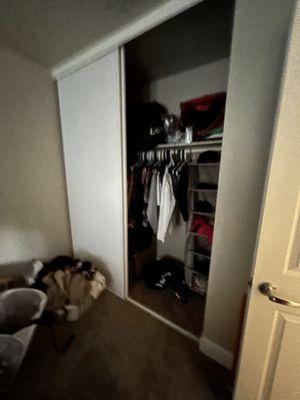 Pretty good tall sized closet with sliding doors that clip on from the top. The doors are easily removable.