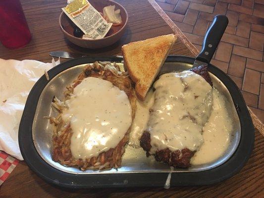 Chicken fried steak and hash browns.