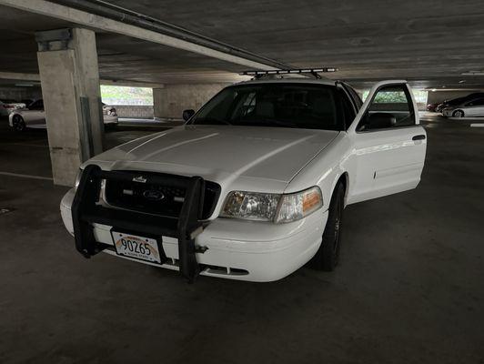 Installed bull bars, siren, grille lights, and lightbar.