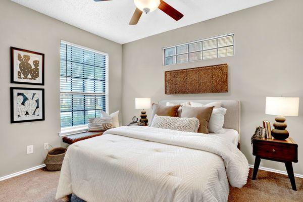 Bedroom with ceiling fan at Carrollton Park of North Dallas