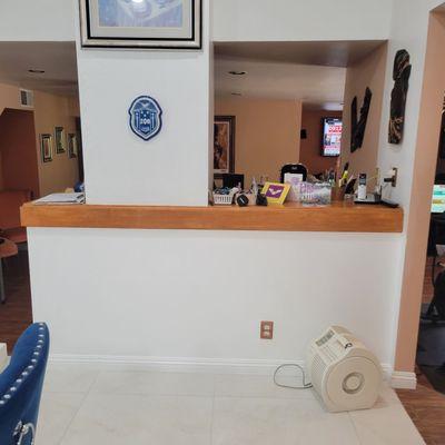 Refinished wood on fireplace to match kitchen island.