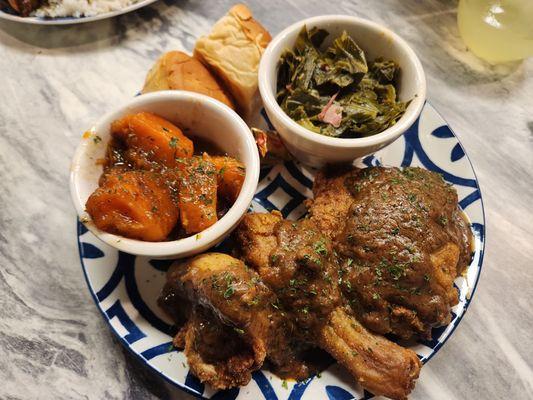 Smothered Fried Chicken w/ dinner Rolls. Greens & Yams as the 2 sides.