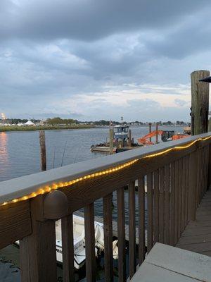 Eating outside on the deck on the water.