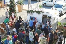 Kringle mingle with Santa in the Camera Camper photo booth!