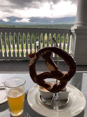 Pretzel with mustard and beer dip