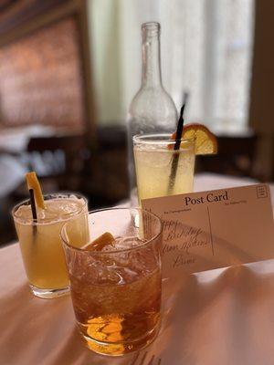 Visitors get personalized post cards. The drinks are clockwise- Old Fashioned, Brand Sour, Orange Gin Fizz