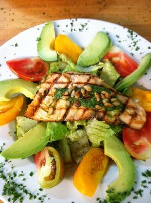 Organic Heirloom Tomato, Avocado Salad. With toasted pine nuts on a bed of romaine with pesto balsamic dressing