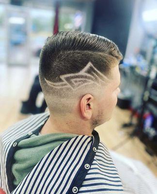 Mid skin fade with freestyle design by Chase