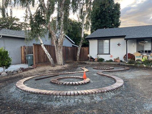 Before: (2-4 photo) design with pavers before adding rocks around and inside.