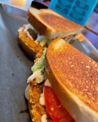 RUSTLER'S Chicken Fried Steak BBQ melt sandwich on Sourdough bread, pepper jack cheese Mayo, lettuce and tomatoes .toasted to perfection