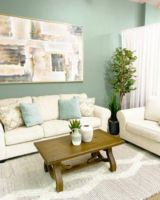 Ivory sofa, loveseat, and chair