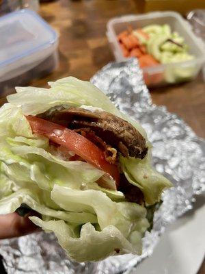 bun-less jr bacon cheeseburger being smothered by lettuce