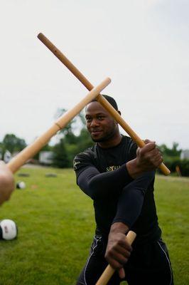 Personal training session teaching Kali and Satria Silat.