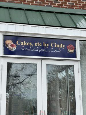 Outdoor signage over porch seating