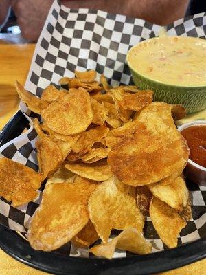 Homemade chips (to die for) and cheese queso blanco w/side of sriracha YUMMM!