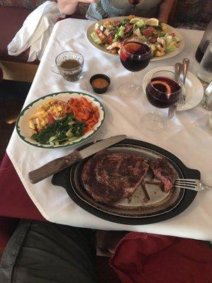 14 ounce Ribeye and side of vegetables. You can see the secret recipe Sangria as well.  Life is good!